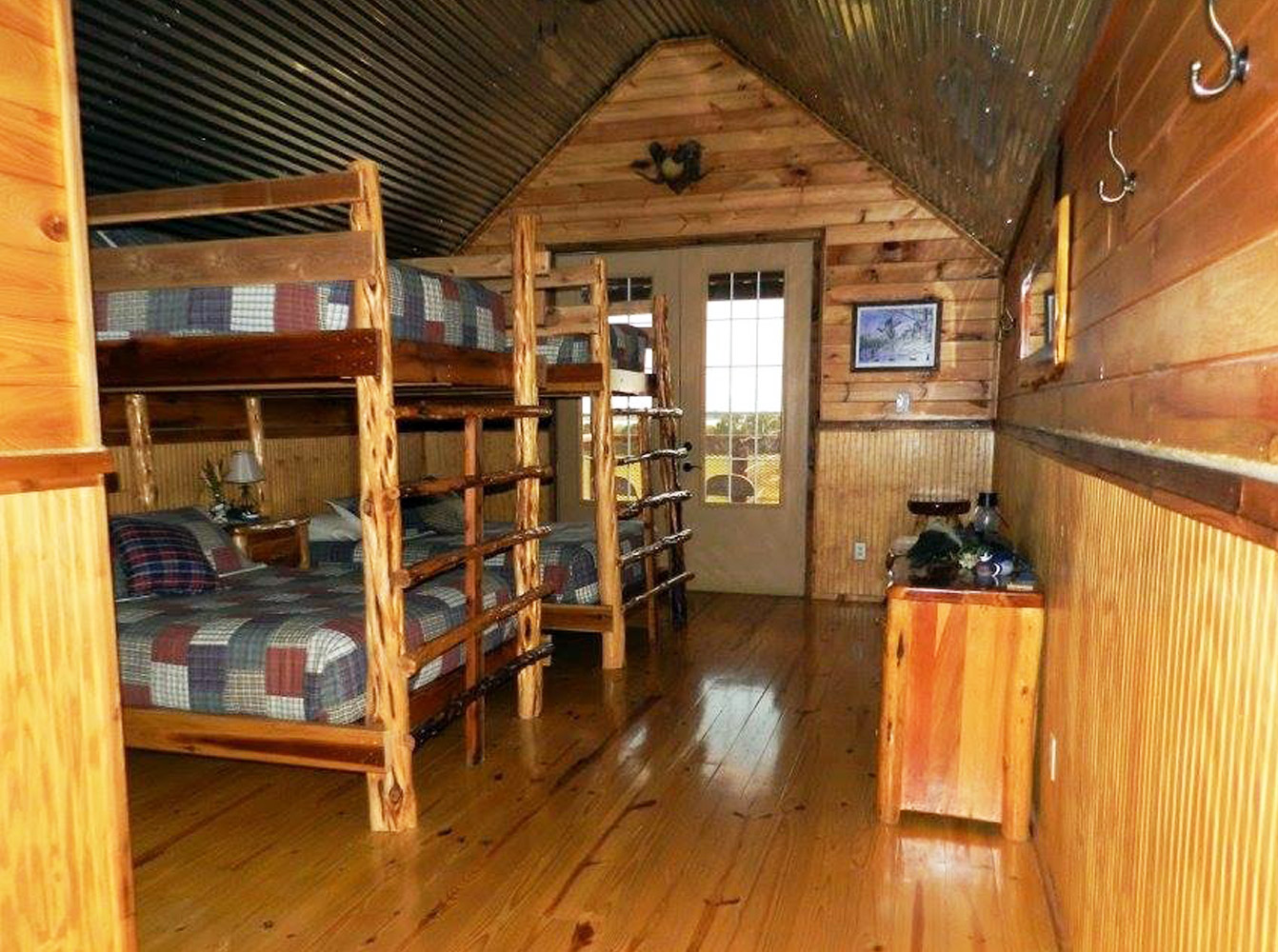 two double-deck beds in a room