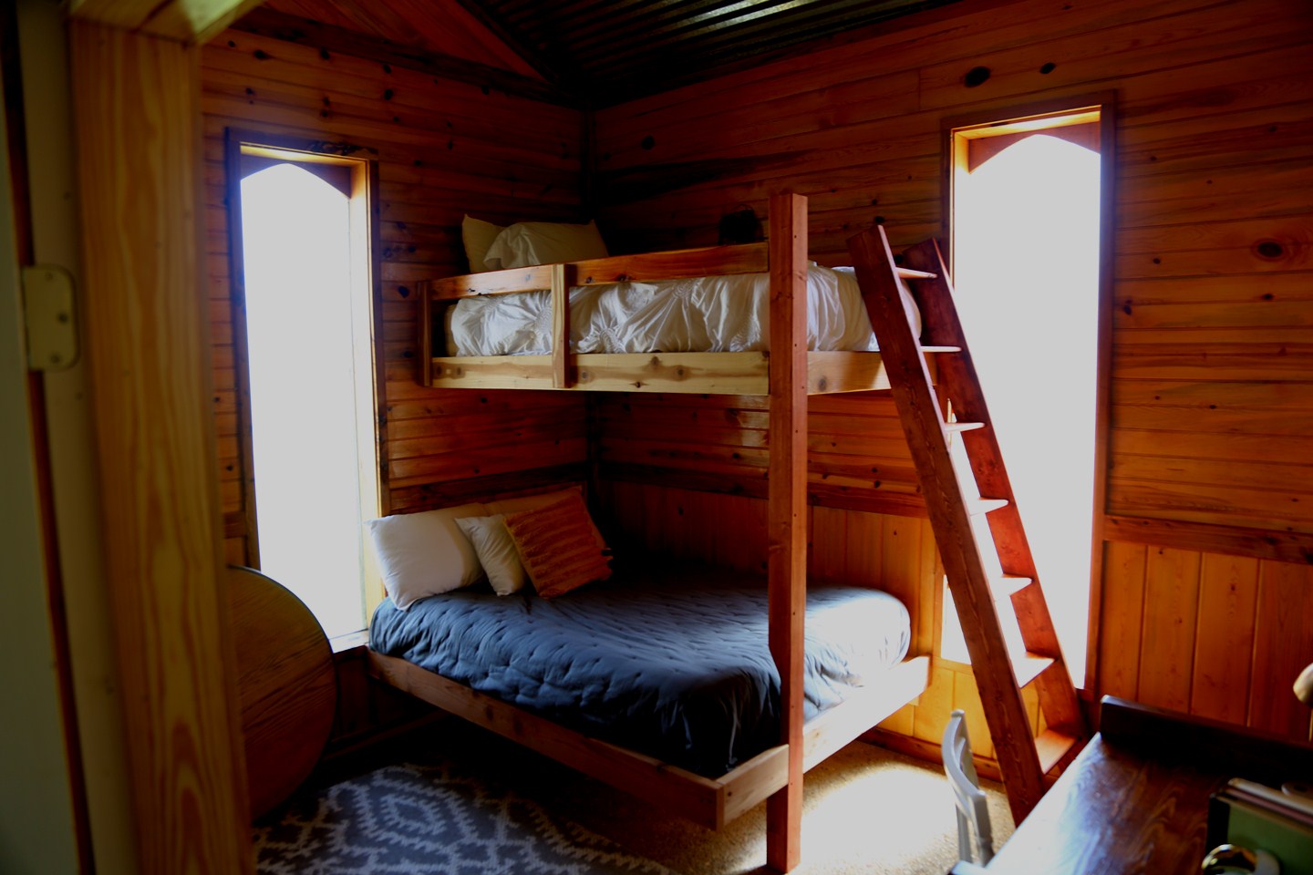 a double-deck bed inside a small room